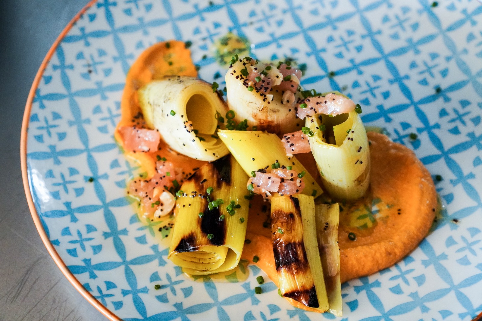 Sevillian leeks confit with romesco sauce